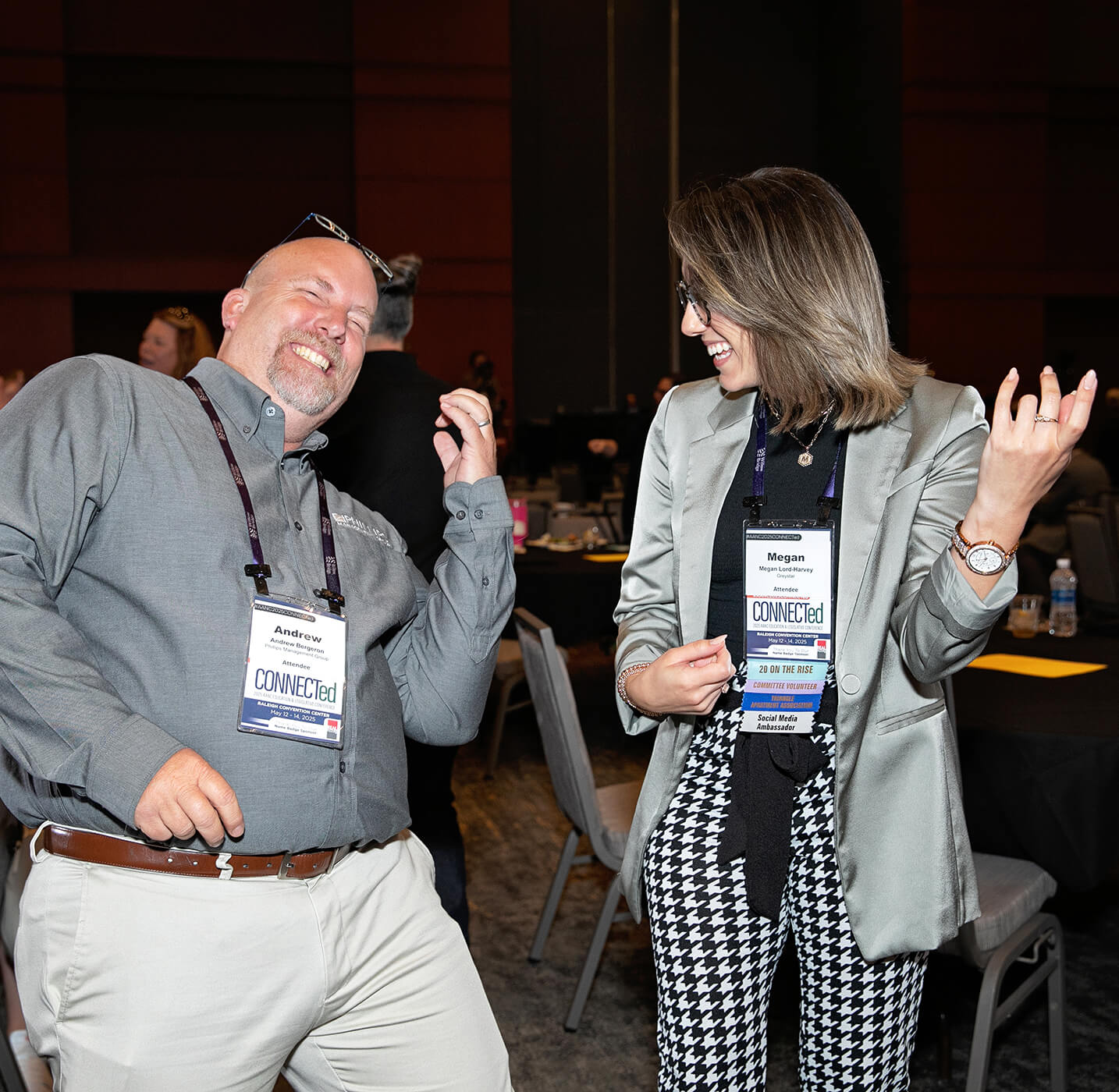 male attendee playing air guitar