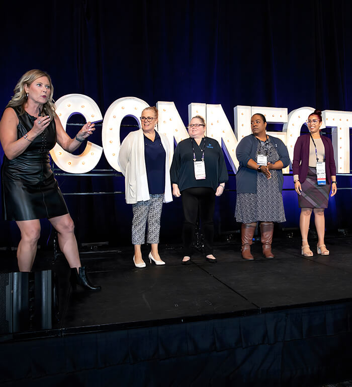 deborah on stage with audience memebers