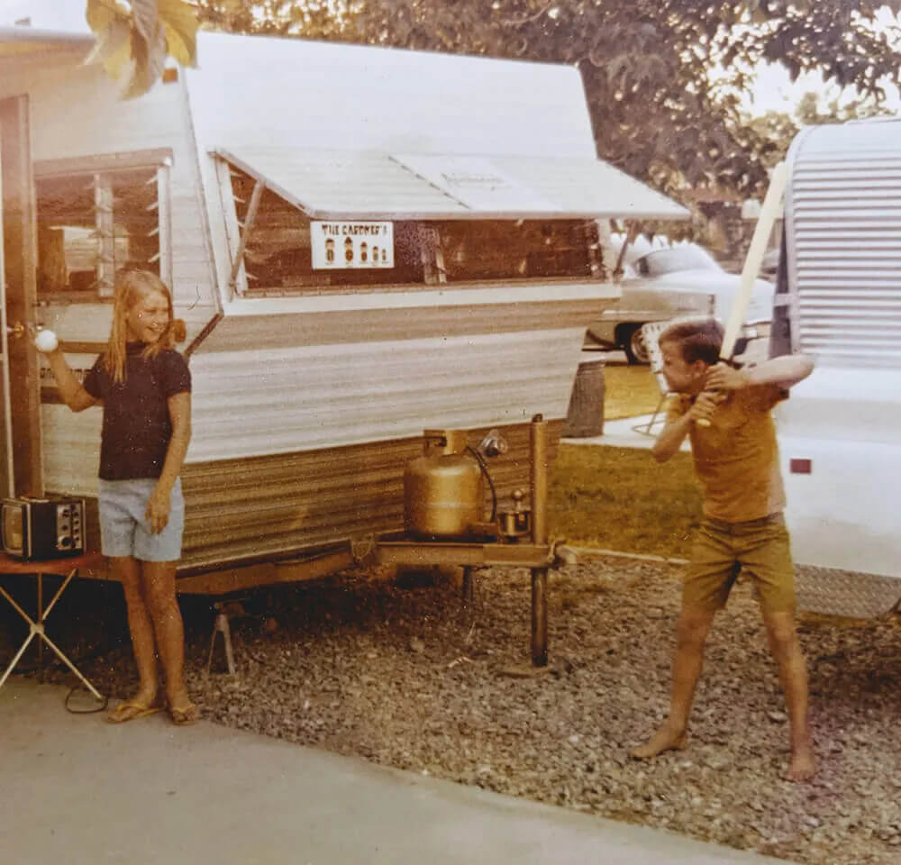 deborah next to old trailer
